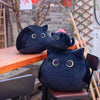 Peluche chaton noir aux grands yeux