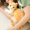 Peluche chat tigré orange couché