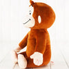 Peluche singe souriante