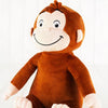 Peluche singe souriante