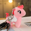 Peluche licorne rose de corne dorée