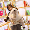 Peluche cheval beige couché