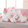 Peluche licorne blanche arc-en-ciel