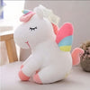 Peluche licorne blanche arc-en-ciel