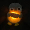 Peluche pingouin qui respire avec berceuses intégrées