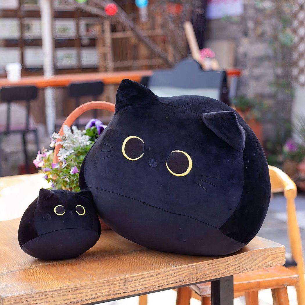 Peluche chaton noir aux grands yeux