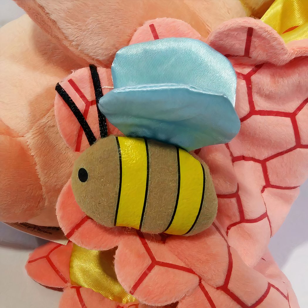 Peluche Winnie l'Ourson dans sa couverture