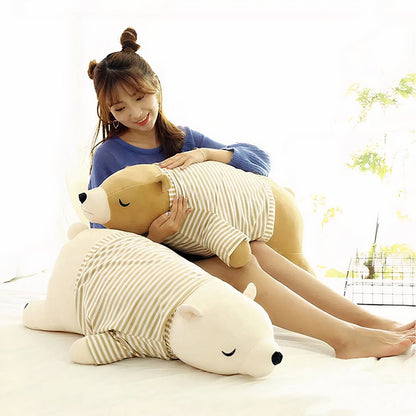 Peluche ours marron habillé qui dort