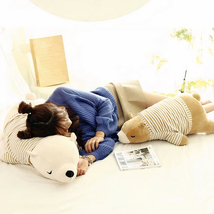 Peluche ours marron habillé qui dort