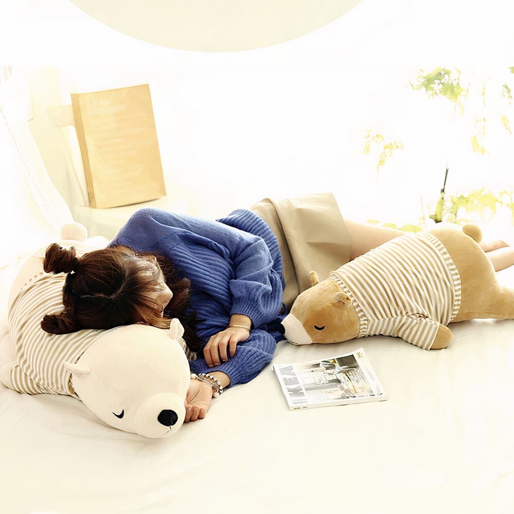 Peluche ours blanc habillé qui dort
