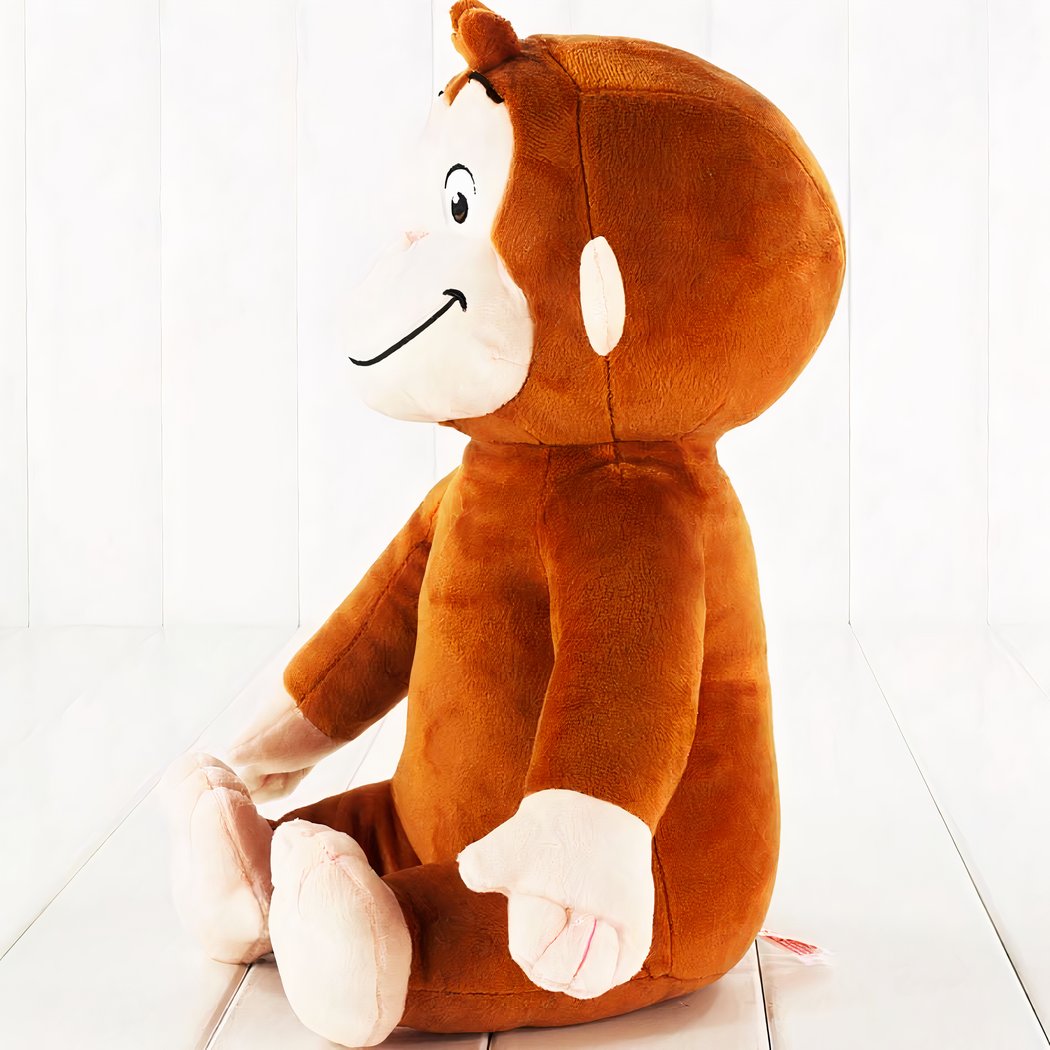Peluche singe souriante