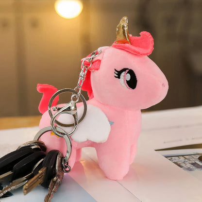 Peluche licorne rose de corne dorée