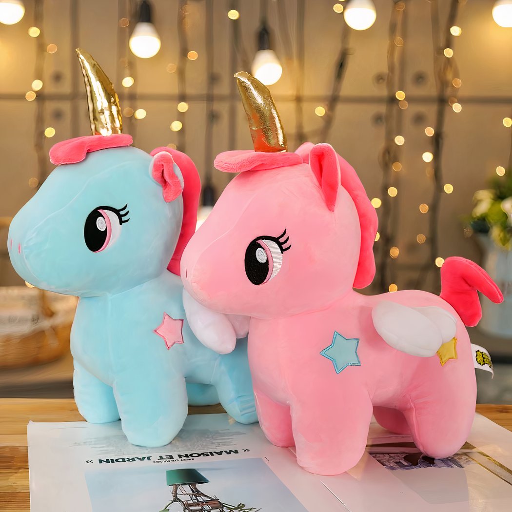 Peluche licorne rose de corne dorée