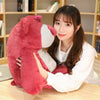 Giant Lotso Toy Story bear plush hugged by a woman