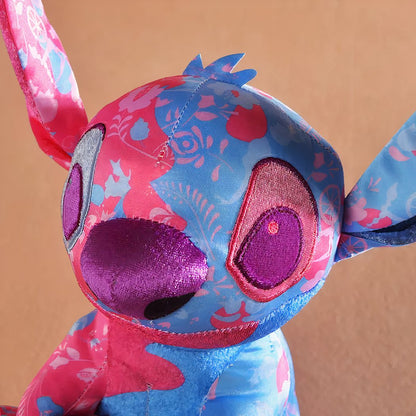 Peluche Stitch colorée rose et bleu clair Disney pour enfant