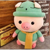 Peluche cochon habillé tenue verte