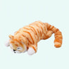 Peluche chat tigré orange endormie