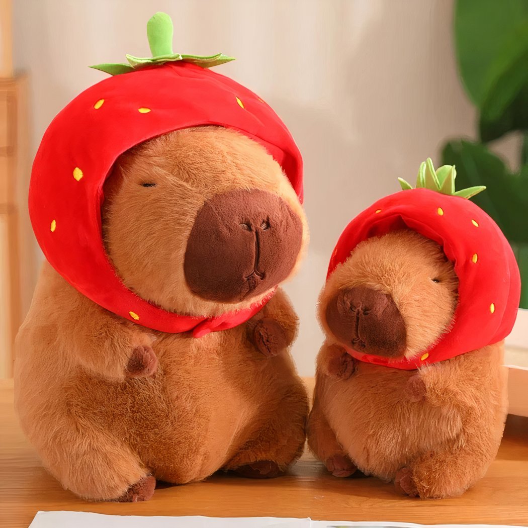 Peluche capybara avec chapeau fraise