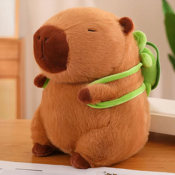 Peluche capybara avec sac à dos tortue