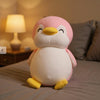 Peluche pingouin rose souriant