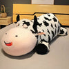Peluche vache allongée