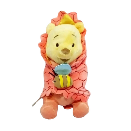 Peluche Winnie l'Ourson dans sa couverture