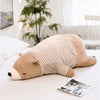 Peluche ours marron habillé qui dort