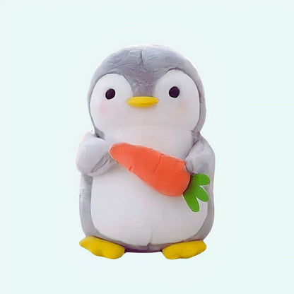 Peluche pingouin carotte
