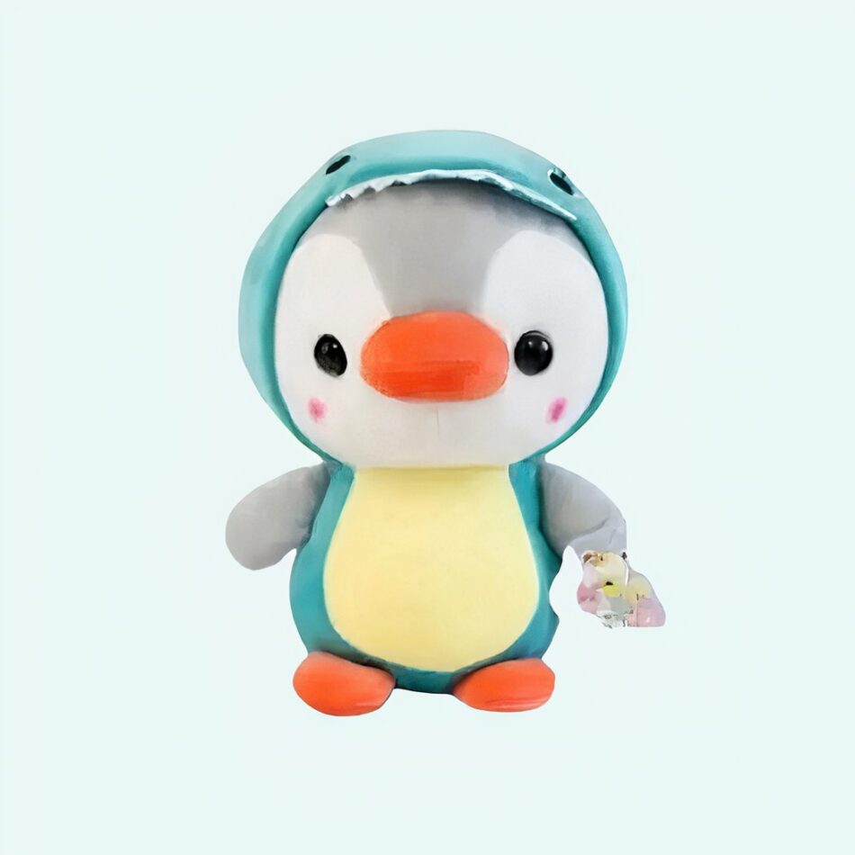 Peluche pingouin déguisé en dinosaure