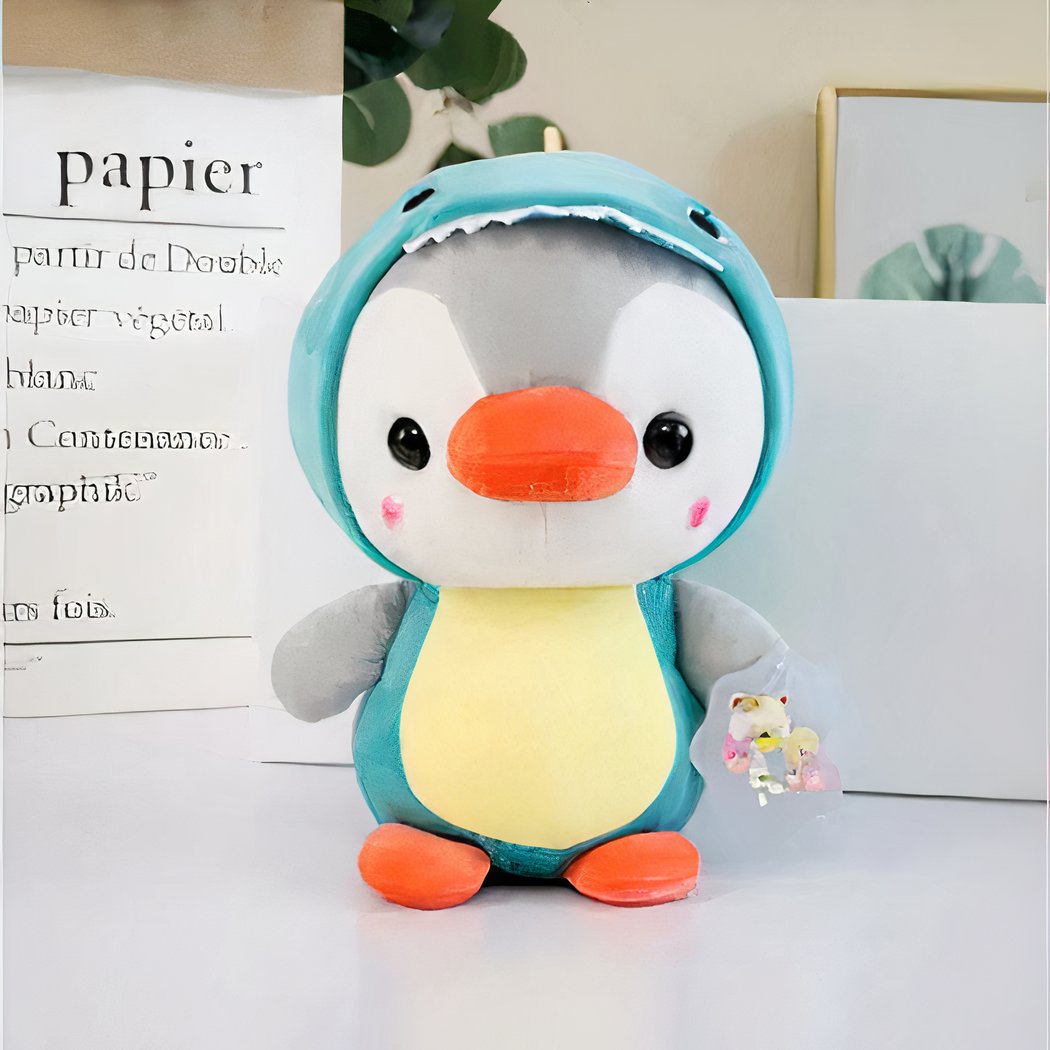 Peluche pingouin déguisé en dinosaure