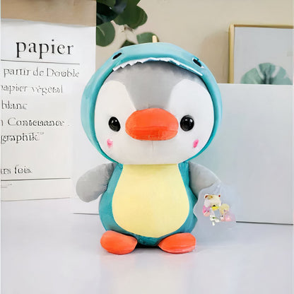 Peluche pingouin déguisé en dinosaure