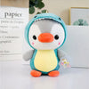 Peluche pingouin déguisé en dinosaure