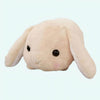 Peluche lapin beige couché
