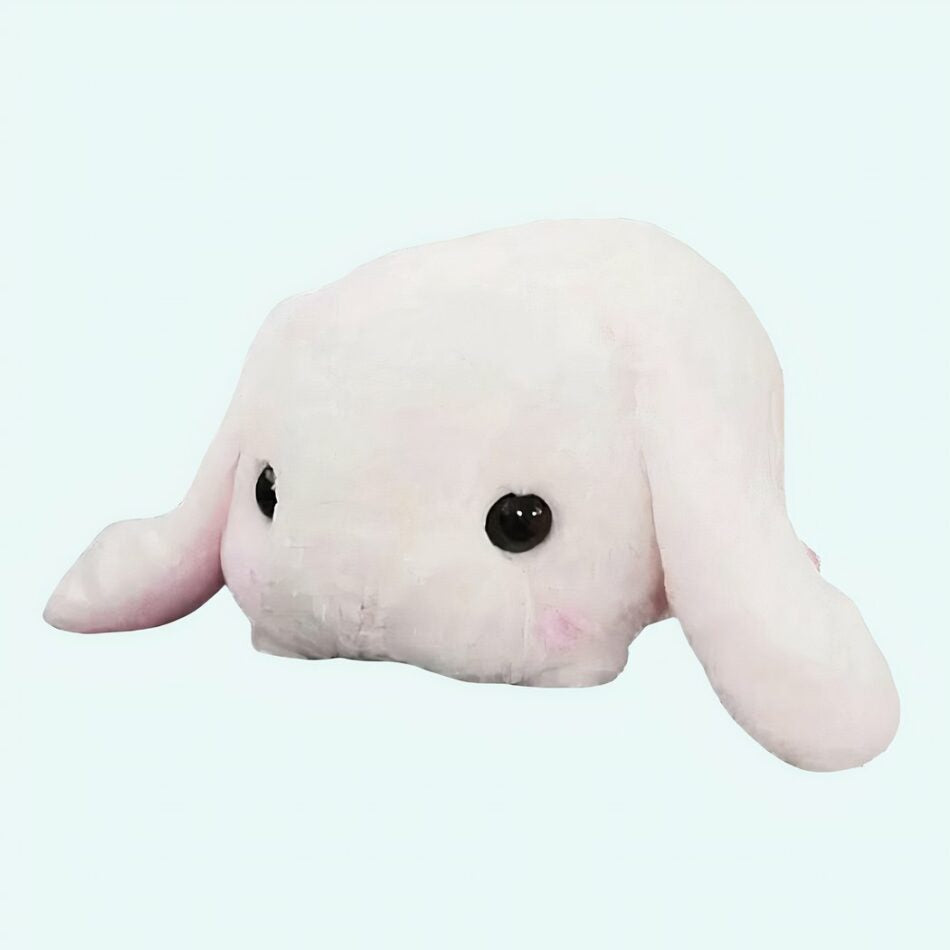 Peluche lapin blanc couché