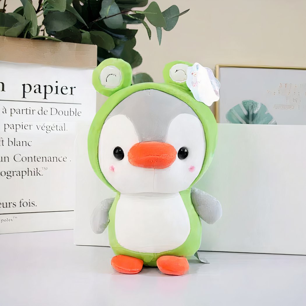 Peluche pingouin déguisé en grenouille