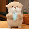 Beige otter plush holding a light blue fish toy.