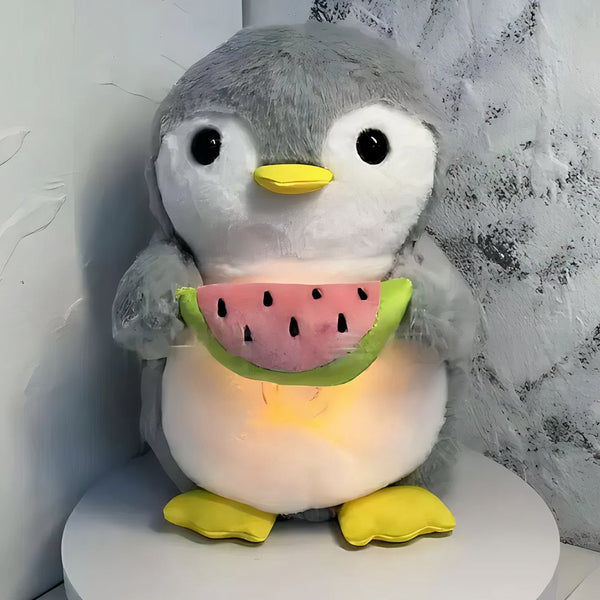 Peluche pingouin qui respire avec berceuses intégrées