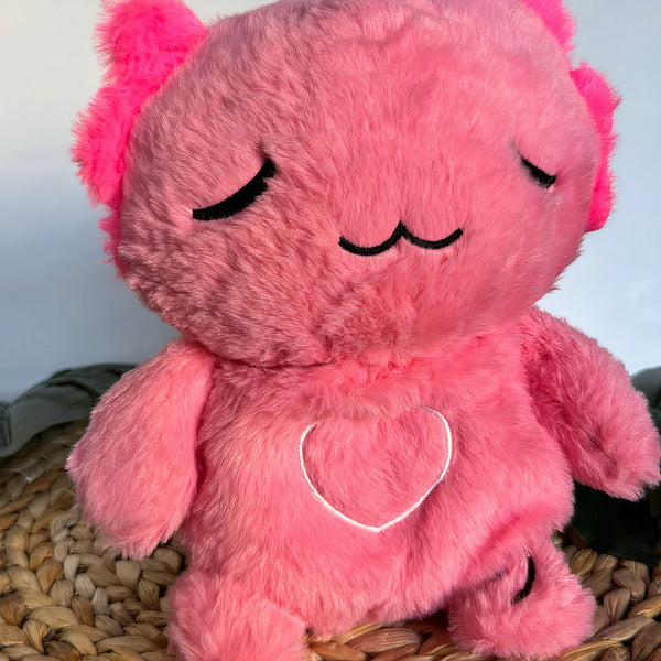 Peluche veilleuse rose d'axolotl qui respire avec berceuses intégrées