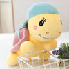 Peluche tortue violette à casquette