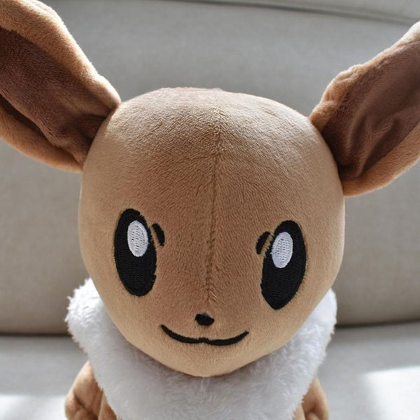 Peluche Evoli déguisée en Pikachu