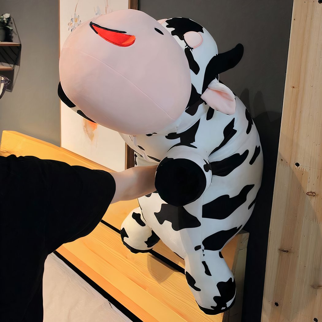 Peluche vache allongée