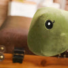 Peluche dinosaure vert