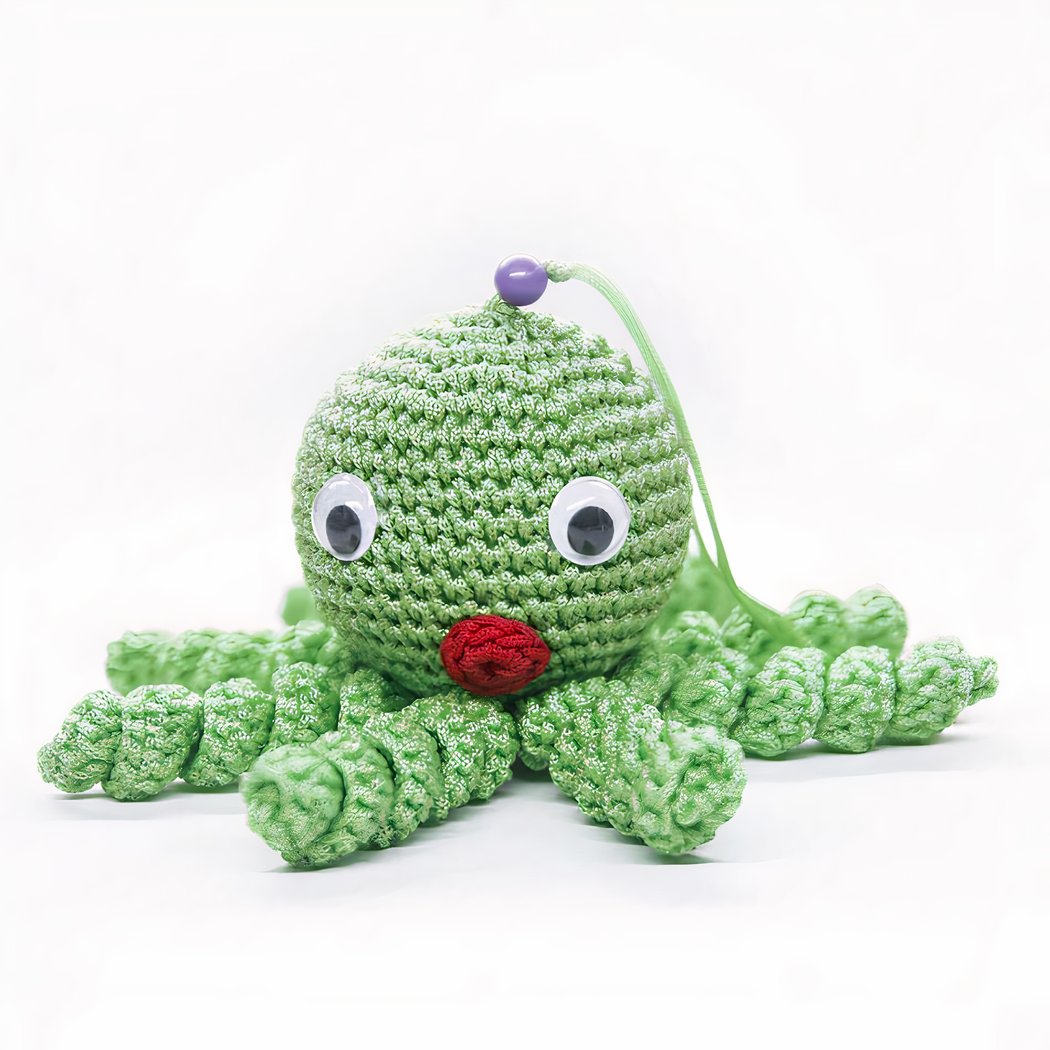 Peluche poulpe verte douce tressée pour enfant