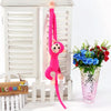 Peluche singe kawaii longue queue fushia