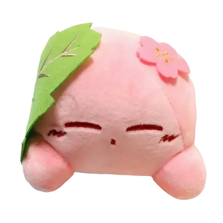 Petite peluche Kirby dans feuille verte