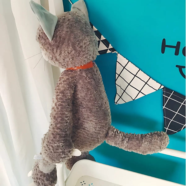 Peluche chat beige mécontent assis