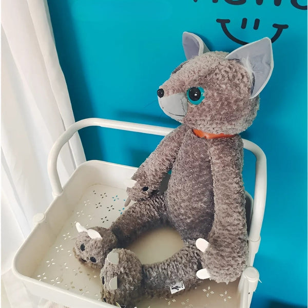 Peluche chat beige mécontent assis