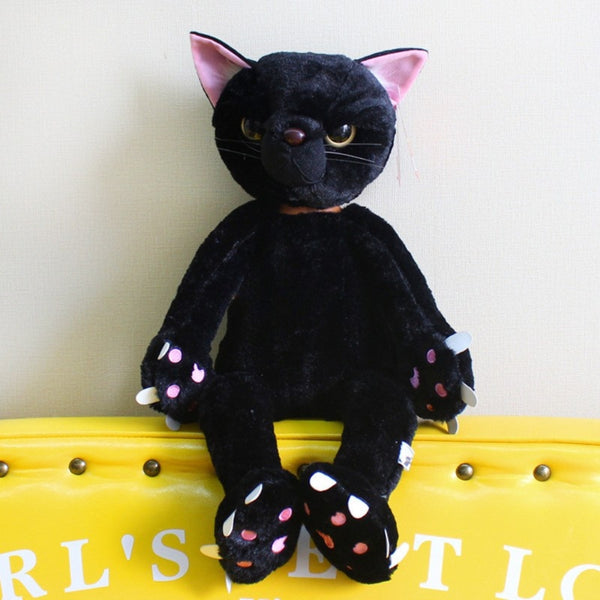 Peluche chat noir mécontent assis
